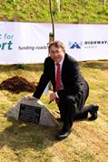 Paul Clark MP, Parliamentary under secretary of state, Department for Transport unveils the commerative plaque