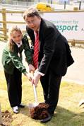 Jessica Strutt and Paul Clark plant the tree