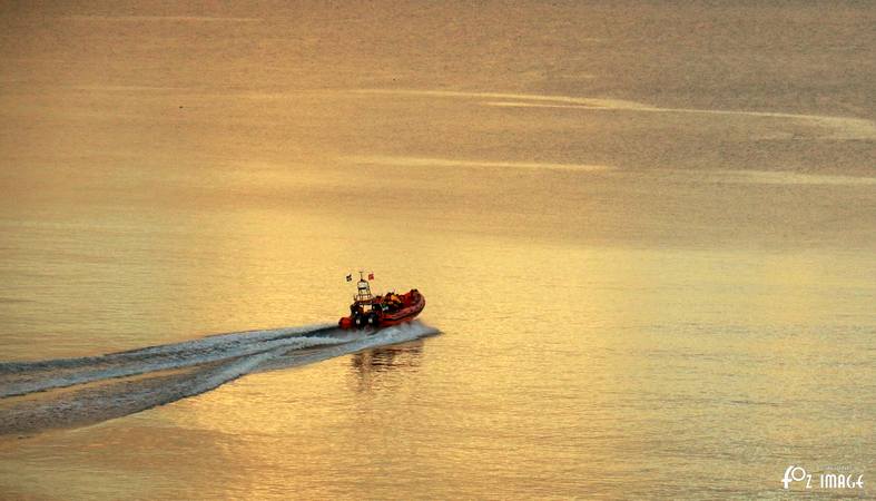 Looe RNLI Atlantic 85 launching at sunset