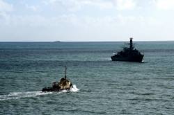 Tug boat and HMS Somerset