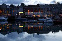 Christmas lights reflecting in Padstows inner harbour