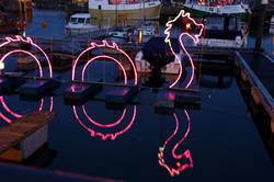 Christmas lights reflecting in Padstows inner harbour