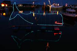 Christmas lights reflecting in Padstows inner harbour