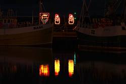 Christmas lights reflecting in Padstows inner harbour