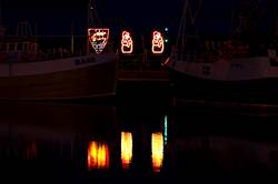 Christmas lights reflecting in Padstows inner harbour