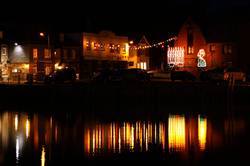 Christmas lights reflecting in Padstows inner harbour