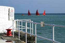 Sailing out into Looe Bay