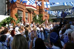 Padstow institute - Blue Ribbon Oss appears in the street