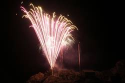 Polperro fireworks over Peak rock and the harbour