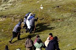 The soldiers drag Piran onto the cliff top